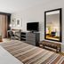 Country Inn & Suites by Radisson, Roanoke, VA guest room with two beds, desk, TV and mirror