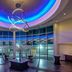 Sheraton Eatontown Hotel lobby with blue-lit circular ceiling and modern chandelier in Eatontown