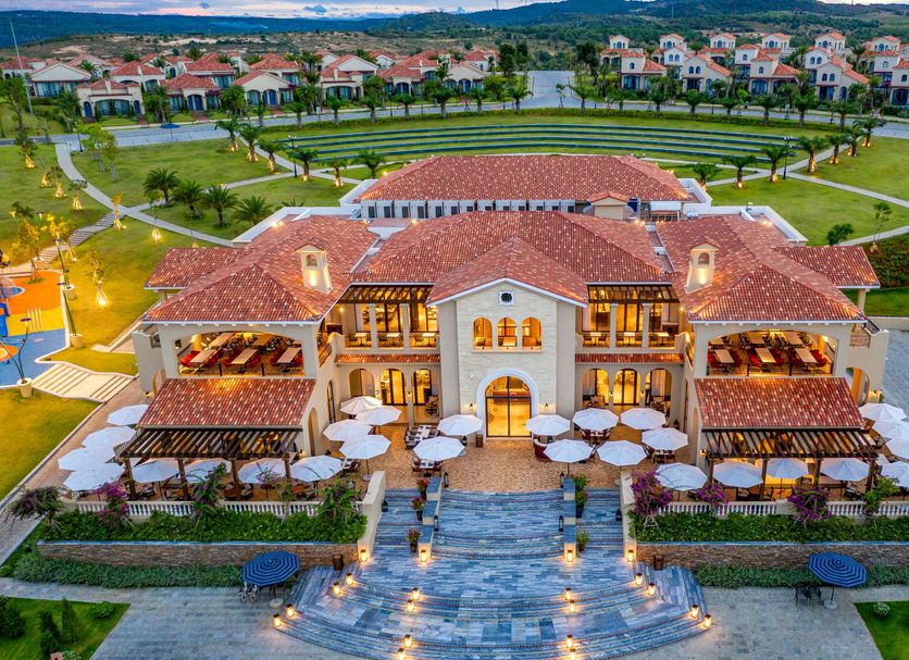 Centara Mirage Resort Mui Ne in Phan Thiet, aerial view of a terracotta-roofed resort with landscaped grounds