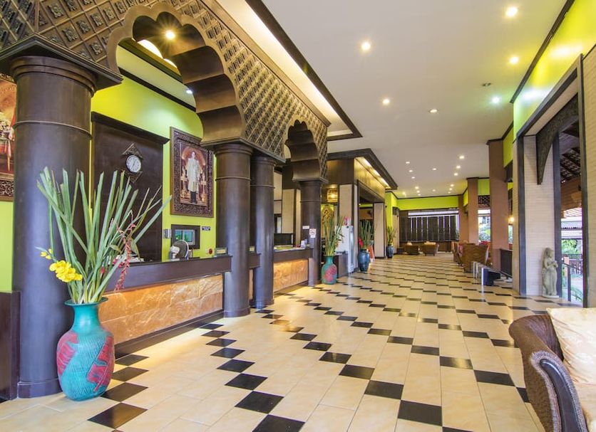 Phuphaya Resort Pattaya lobby with arched columns, patterned floor, and check-in counter in Pattaya