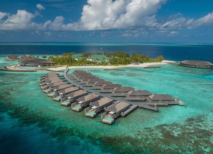 Kagi Maldives Resort & Spa overwater villas on a turquoise lagoon in Kagi