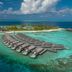 Kagi Maldives Resort & Spa overwater villas on a turquoise lagoon in Kagi