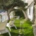 La Maliosa D' Arienzo in Positano with sun loungers on a grassy terrace overlooking the sea and cliffs