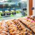 Hotel La Pergola, Lignano Sabbiadoro: pastry buffet with donuts, muffins and sliced cakes by a window