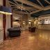 Bajamar Beach Hotel Formia lobby with reception desk, seating area, and polished marble floor