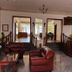 Oasey Beach Hotel in Bentota lobby with leather chairs, staircase and reception desk