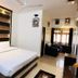Ritumbhara Resorts Alwar room with king bed, sofa, ceiling fan and window seating