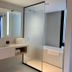 Krista Boutique Hotel Buenos Aires bathroom with double vanity, glass shower, and soaking tub