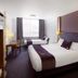 Premier Inn Belfast Titanic Quarter room with two beds, desk and window seating in Belfast