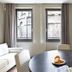 Allegroitalia San Pietro All'Orto 6 Milan room with round table, sofa and city-view windows