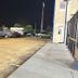 Americas Best Value Inn & Suites Senatobia exterior parking lot at night beside the hotel building
