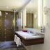 Hotel Sonneck, Schwäbisch Hall bathroom with walk-in shower, vanity, and illuminated mirror