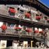 Chalet Appart'Hôtel l'Eau Vive in Saint-Nicolas-la-Chapelle, chalet exterior with flower-filled balconies