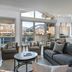 Antlers at Vail living room with sofa, armchairs and balcony access overlooking Vail mountains