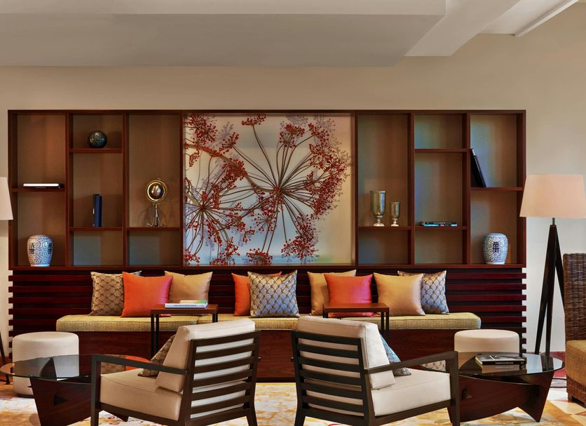 Sheraton Mallorca Arabella Golf Hotel lounge in Palma de Mallorca with patterned seating and a decorative wall feature.