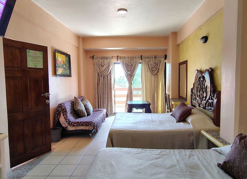Hotel Marbella Playa Larga in Ixtapa guest room with two beds and balcony doors