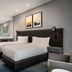 Cape Town Marriott Hotel Crystal Towers guest room with two beds, modern bathroom area, and city-style decor