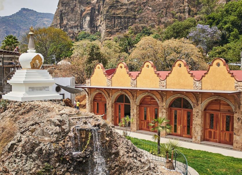 La Buena Vibra Retreat and Spa Hotel in Tepoztlán with waterfall, garden and mountain backdrop