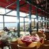 Seehotel Berlin-Rangsdorf restaurant with lakeside window seating and outdoor terrace views in Rangsdorf