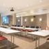 Achat Hotel Monschau meeting room with long conference tables and red chairs in Monschau