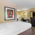 Extended Stay America Suites - Bakersfield - California Avenue room with bed, desk, TV, and closet