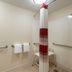 Red Roof Inn Detroit - Farmington Hills accessible shower with grab bars and fold-down seat