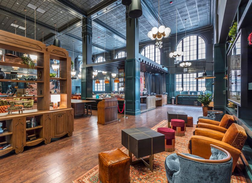 Hotel Indigo Nashville - The Countrypolitan By IHG lobby with lounge seating and tall arched windows