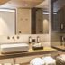Hotel Olangerhof in Valdaora bathroom with double sinks, mirror wall, and neatly folded towels