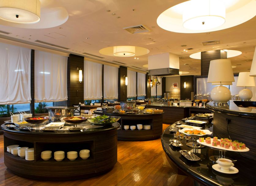Hotel Jal City Naha in Naha buffet restaurant with circular serving stations and large ceiling lights