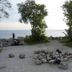 Humber College Lakeshore Residence in Toronto, lakeside fire pit area with trees and water view