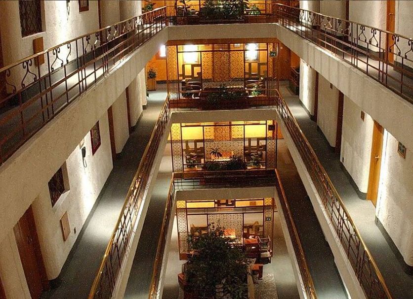 Hotel Gillow in Mexico City interior atrium with multiple balconies and seating areas