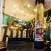 Raha Grand Hotel Patong lobby with reception desk, chandelier lighting, and ornate columns
