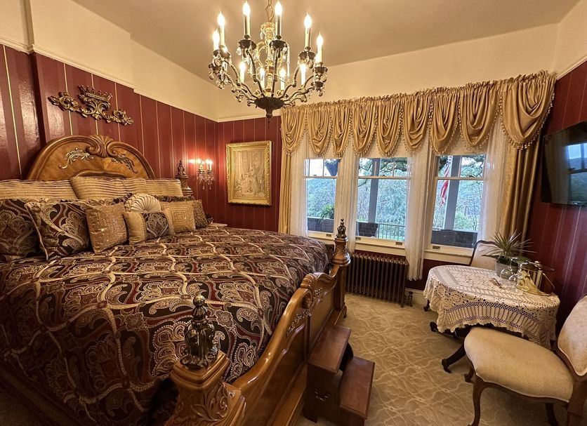 The Inn on Knowles Hill Bed & Breakfast Hotel in Sonora, ornate guest room with chandelier and window view
