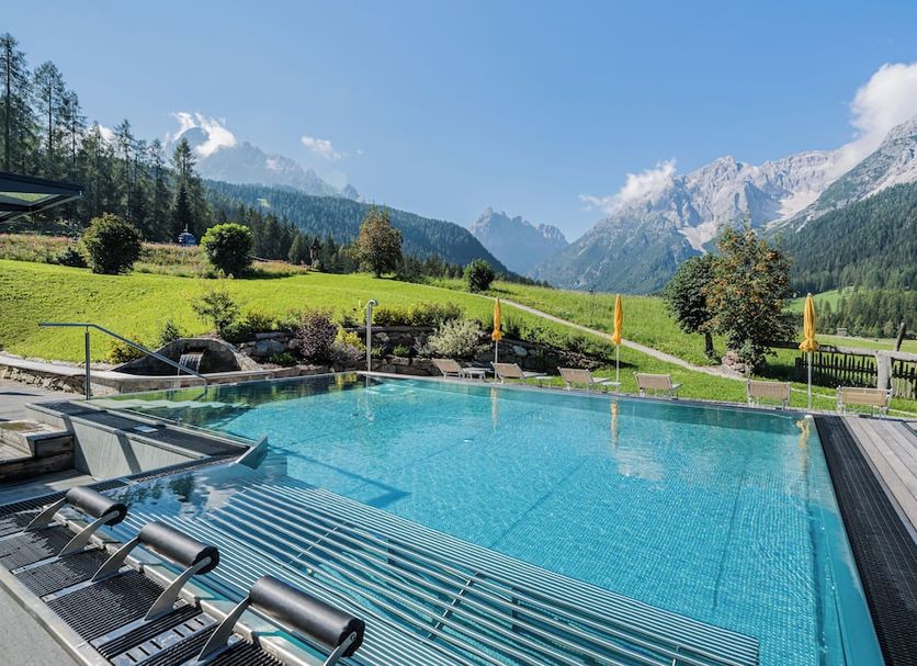 Family Resort Rainer Sexten infinity pool with mountain views in Sesto