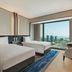 Hilton Saigon twin guest room with floor-to-ceiling city view in Ho Chi Minh City