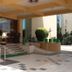 Seven Sky Clarks Exotica Bhuj hotel entrance with steps, glass doors, and potted plants