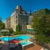 1886 Crescent Hotel and Spa in Eureka Springs with outdoor pool and hot tub beside the historic stone hotel