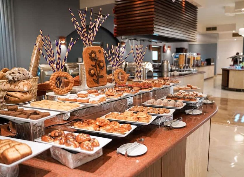 Sentido Akassia beach buffet breakfast spread in Al Quşayr with pastries and breads