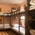 Hostel Himalaya, Kathmandu: dorm room with bunk beds and stacked towels by the window