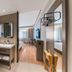 Hanting Nanshan Avenue Shenzhen bathroom vanity opening to a bright bedroom with large window