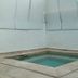 Mar Del Norte in San Juan: small indoor plunge pool surrounded by stone tile walls