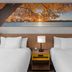 Days Inn by Wyndham Mason City twin room with lake sunset wall art and bedside lamp