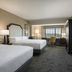 Sheraton Baltimore Washington Airport Hotel - Bwi guest room with two beds, desk, and window view in Linthicum Heights