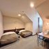 Hotel Sun Abashiri room in Abashiri with two single beds and a small dining table