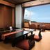 Houraiya in Kamogawa: traditional tatami room with low table and ocean view through large window