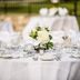 Maxwelton Braes Lodge in Baileys Harbor: round banquet table with white linens, glassware and floral centerpiece