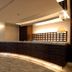 Center Hotel Toyota lobby reception desk with curved wood front and soft lighting