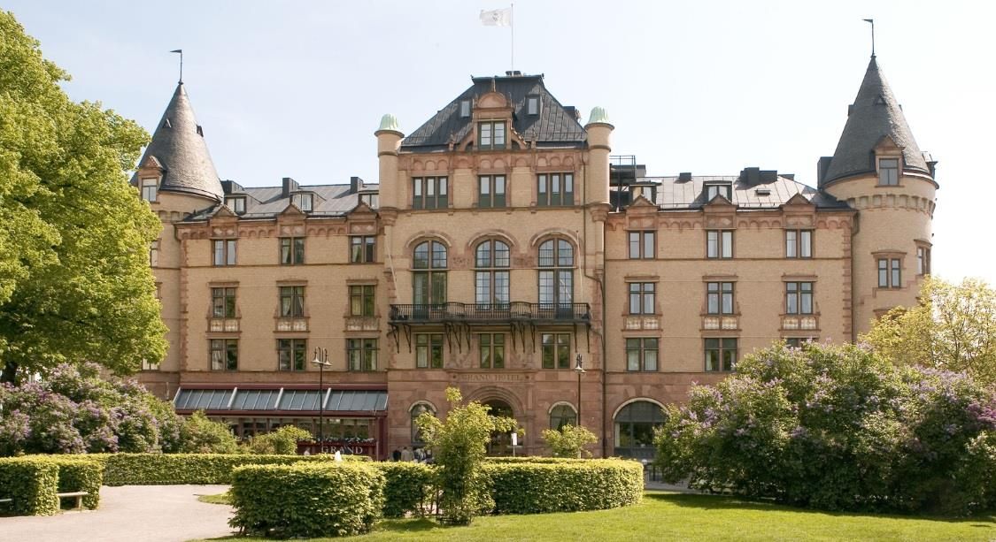 Grand Hotel Lund in Lund, grand historic hotel facade with turrets and manicured garden
