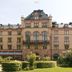 Grand Hotel Lund in Lund, grand historic hotel facade with turrets and manicured garden