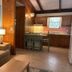 Tropical Resort & Marina on Lake Beresford, DeLand: rustic suite with sofa, kitchenette, and lake-themed decor